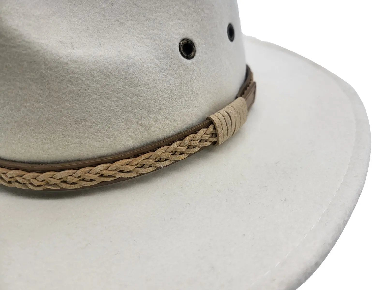 White Western style with our handmade 100% wool felt cowboy hat. Crushable, water-repellent, and supremely comfortable. Features wide brim for sun protection and high crown for ventilation. Available in Black, Brown, Olive-Green, and White, sizes S/M and L/XL. Durable, practical, and timelessly stylish for any cowboy