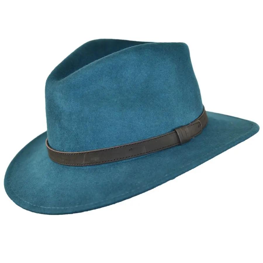 Crushable Wool Fedora Hat with Leather Band. Handmade, unisex, wide-brim (8cm) fedora with a 9cm high teardrop crown, 100% wool, cotton sweatband, and leather strap. Water-resistant and packable. Available in multiple sizes.
The Novella Hats Crushable Wool Fedora Hat is a stylish and functional accessory. Handmade with 100% premium wool, this unisex hat features a classic design with a modern teardrop crown and wide A-line shaped brim.