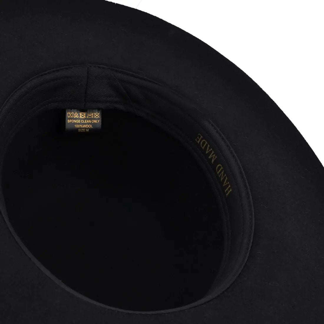 This Bolero Spanish Wide Brim Round Crown Wool Hat is a stylish and versatile accessory. Made from 100% wool felt, it features a stiff flat brim and a round crown, providing a classic yet modern look.