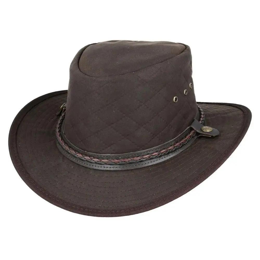 cowboy hat in quilted British waxed cotton with UPF 40+ protection. Features 10cm western crown and shapeable 7.5cm brim. Available in Black, Brown, and Olive, sizes 55-61cm. Complete with chin strap and ventilation. Combines authentic western style with British durability.