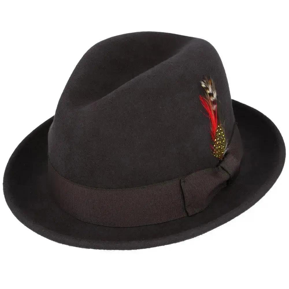 Crushable wool trilby hat with a C-crown. This packable hat is made of 100% wool, featuring a cotton sweatband and no lining. Perfect for travel and everyday wear.
The crushable C-crown trilby hat in black is a stylish and practical accessory. Made from 100% wool, this hat is designed to be packable—simply take it out of a suitcase, shake and shape, and it’s ready to wear. Ideal for both travel and everyday use, this trilby hat combines functionality with timeless style.