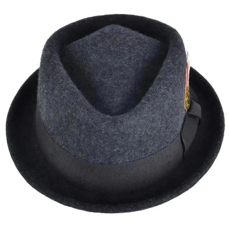 Crushable Wool Felt Diamond Crown Pork Pie Hat. Perfect for travel, this handmade hat features a comfortable cotton sweatband and a removable feather. Available in multiple sizes.
Our Crushable Wool Felt Diamond Crown Pork Pie Hat is packable & perfect for travel, casual wear & special occasions —just take it out of your suitcase, shake and shape, and it’s ready to wear.
