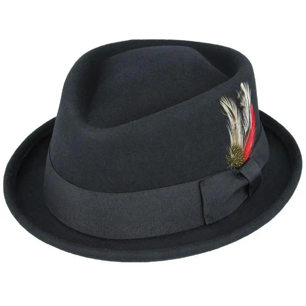 Crushable Wool Felt Diamond Crown Pork Pie Hat. Perfect for travel, this handmade hat features a comfortable cotton sweatband and a removable feather. Available in multiple sizes.
Our Crushable Wool Felt Diamond Crown Pork Pie Hat is packable & perfect for travel, casual wear & special occasions —just take it out of your suitcase, shake and shape, and it’s ready to wear.