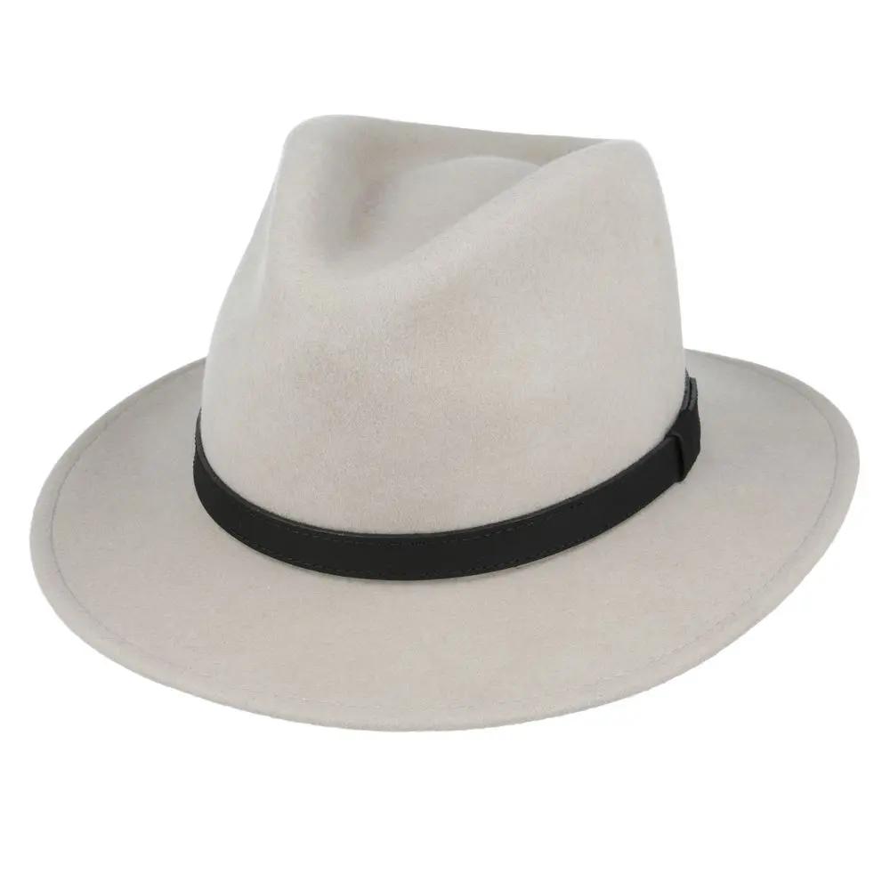Crushable Wool Fedora Hat with Leather Band. Handmade, unisex, wide-brim (8cm) fedora with a 9cm high teardrop crown, 100% wool, cotton sweatband, and leather strap. Water-resistant and packable. Available in multiple sizes.
The Novella Hats Crushable Wool Fedora Hat is a stylish and functional accessory. Handmade with 100% premium wool, this unisex hat features a classic design with a modern teardrop crown and wide A-line shaped brim.