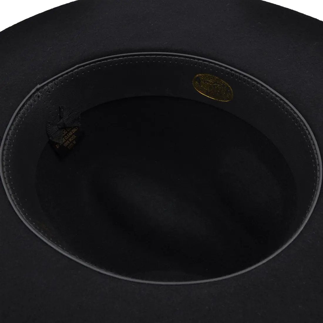 Gladwin Bond Stiff Wide Flat Brim Wool Fedora Hat. Handmade, 100% wool, with a 9cm wide brim and 11cm high crown. Features a comfortable PU sweatband and black belt band. Available in multiple sizes. Full Product Description: Gladwin Bond Stiff Wide Flat Brim Wool Fedora Hat The Gladwin Bond Stiff Wide Flat Brim Wool.