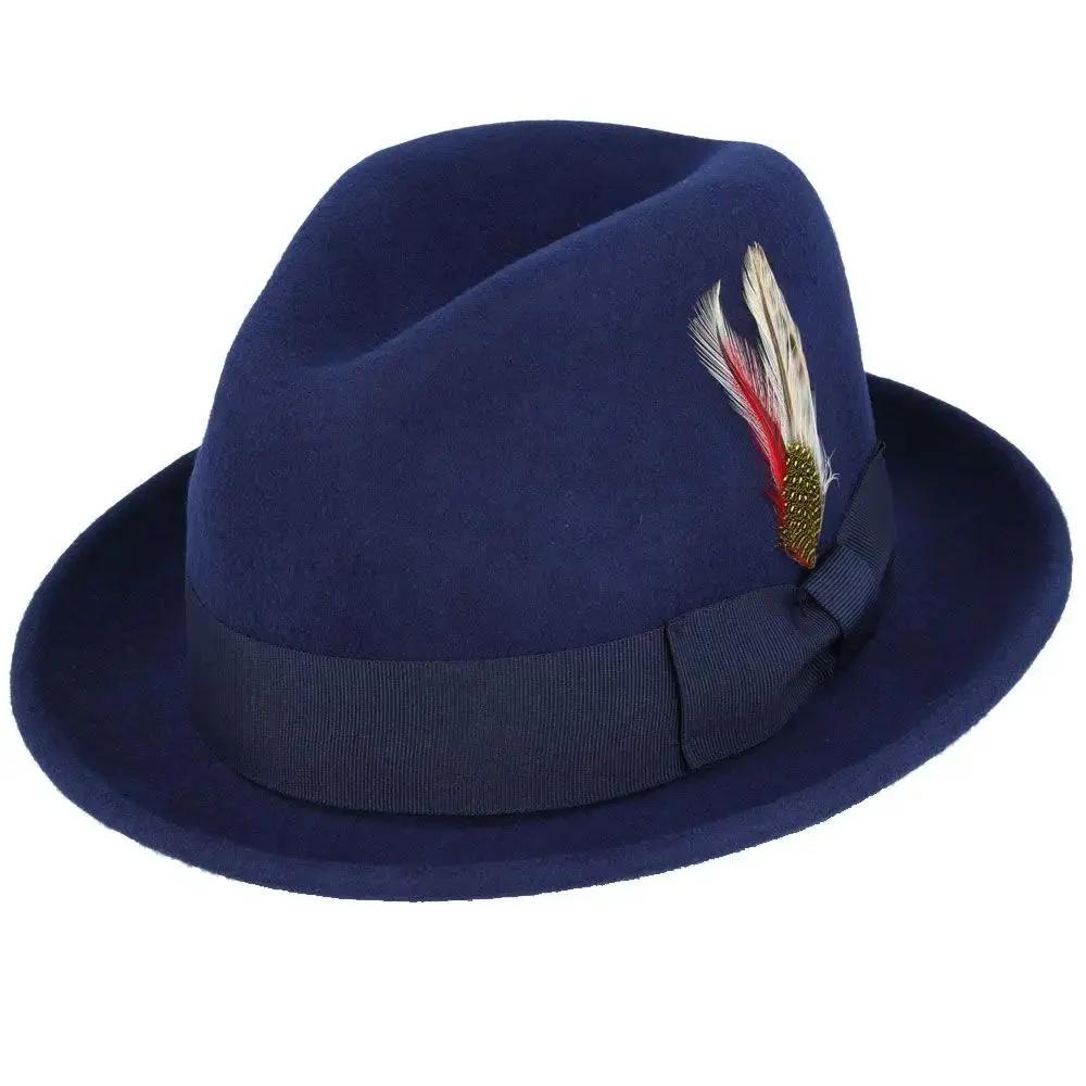 Crushable wool trilby hat with a C-crown. This packable hat is made of 100% wool, featuring a cotton sweatband and no lining. Perfect for travel and everyday wear.
The crushable C-crown trilby hat in black is a stylish and practical accessory. Made from 100% wool, this hat is designed to be packable—simply take it out of a suitcase, shake and shape, and it’s ready to wear. Ideal for both travel and everyday use, this trilby hat combines functionality with timeless style.