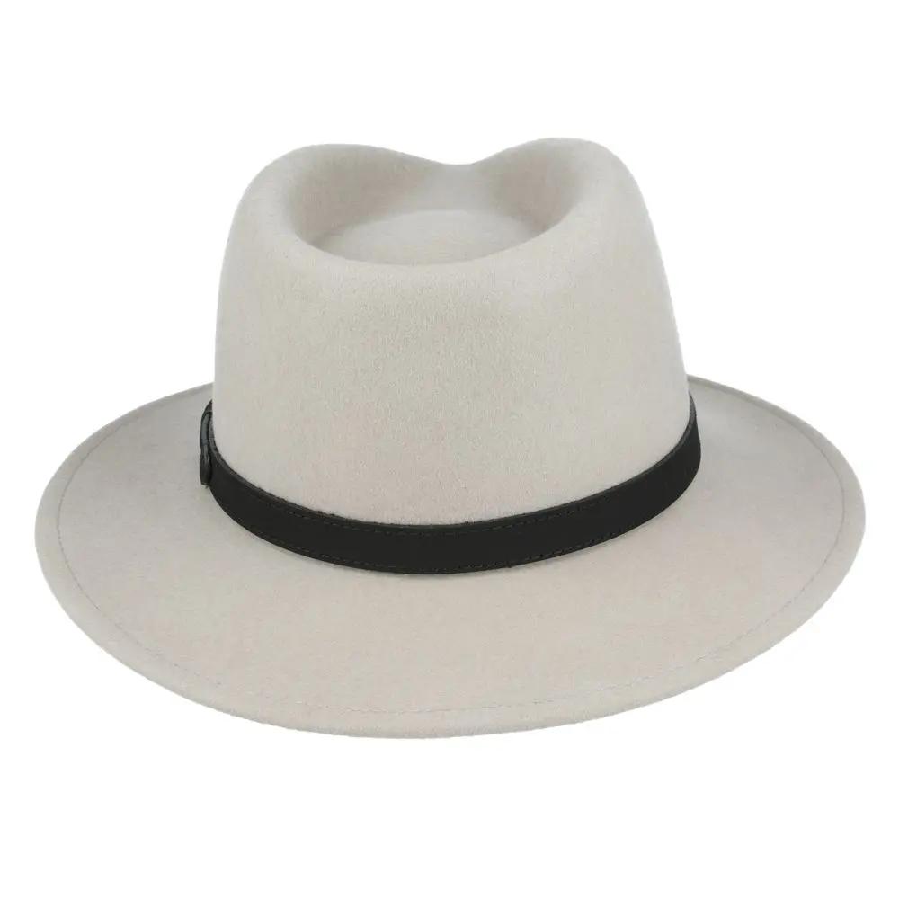 Crushable Wool Fedora Hat with Leather Band. Handmade, unisex, wide-brim (8cm) fedora with a 9cm high teardrop crown, 100% wool, cotton sweatband, and leather strap. Water-resistant and packable. Available in multiple sizes.
The Novella Hats Crushable Wool Fedora Hat is a stylish and functional accessory. Handmade with 100% premium wool, this unisex hat features a classic design with a modern teardrop crown and wide A-line shaped brim.