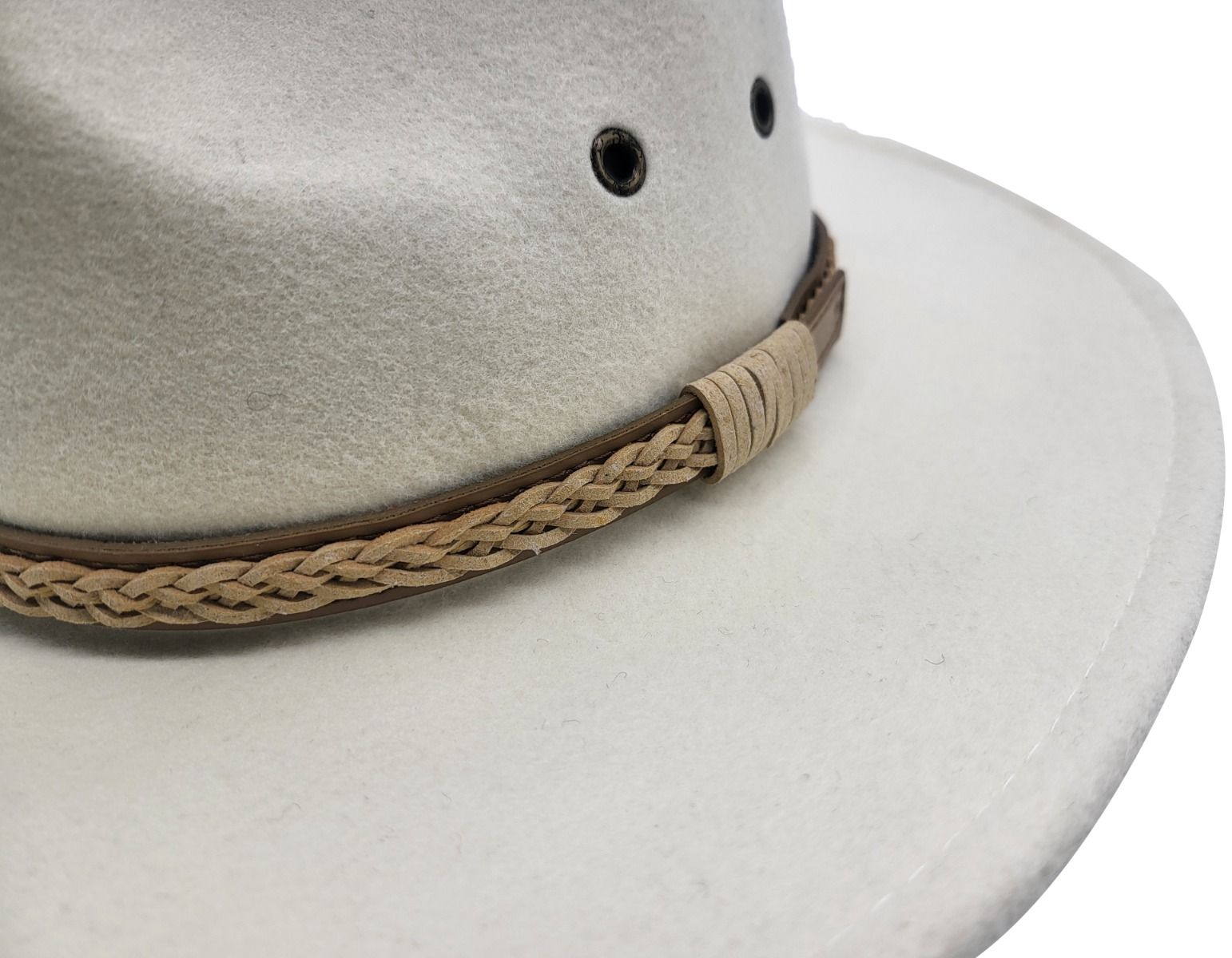 White Western style with our handmade 100% wool felt cowboy hat. Crushable, water-repellent, and supremely comfortable. Features wide brim for sun protection and high crown for ventilation. Available in Black, Brown, Olive-Green, and White, sizes S/M and L/XL. Durable, practical, and timelessly stylish for any cowboy