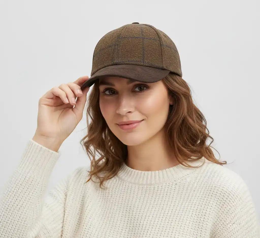 Front view of checked tweed baseball cap with brown suede peak by Novella Hats