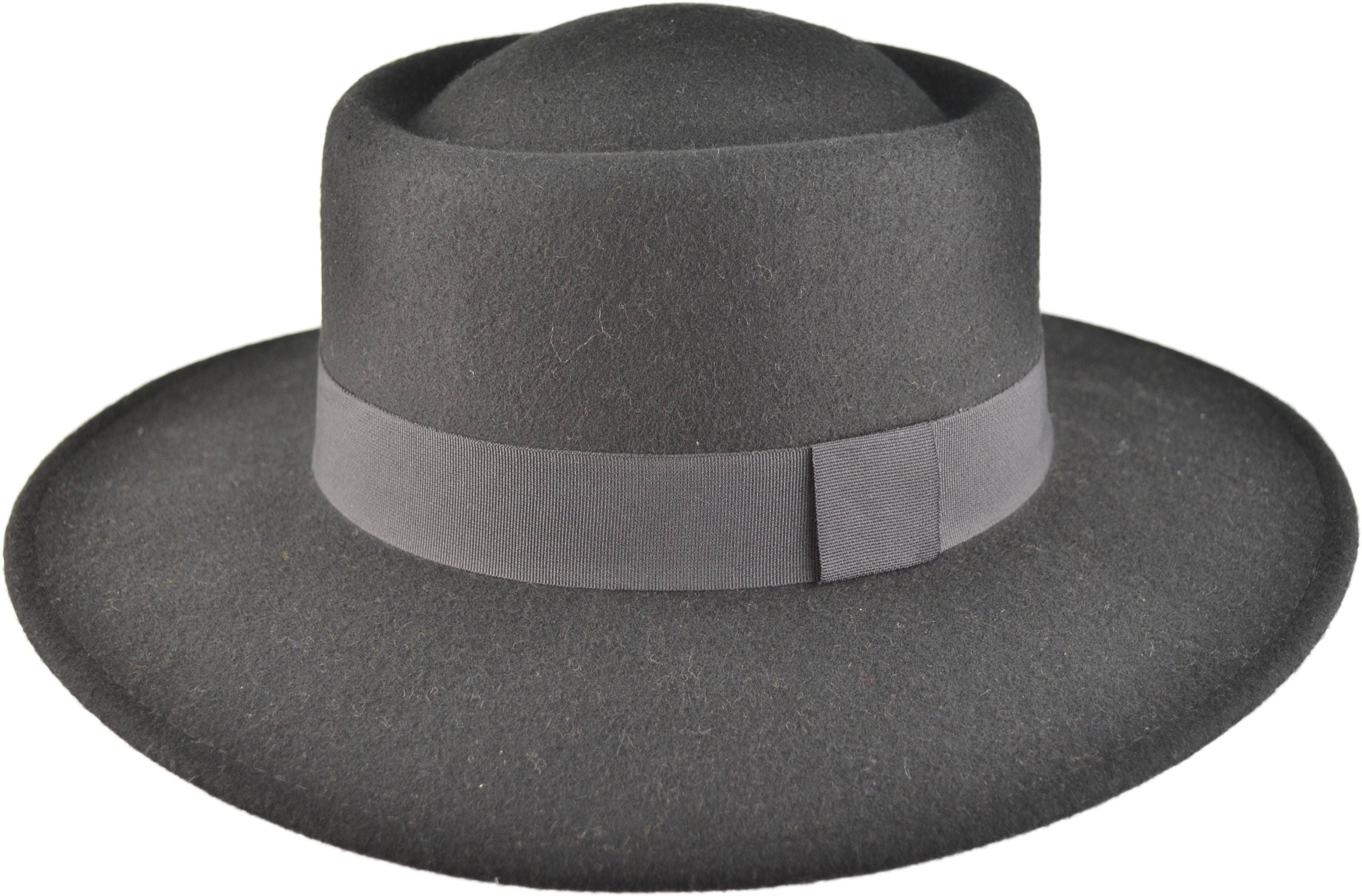 Wide Brim Wool Felt Cloche Hat. Soft, durable wool felt with adjustable interior string for a perfect fit. Classic vintage style meets modern practicality. Ample sun protection with a sophisticated silhouette. Available in Black and Beige. Versatile for both casual and formal occasions.