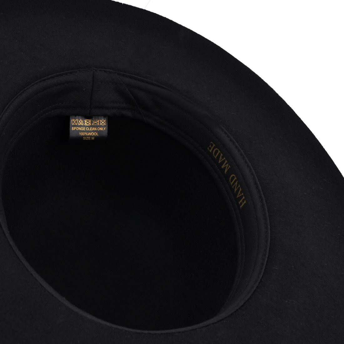 This Bolero Spanish Wide Brim Round Crown Wool Hat is a stylish and versatile accessory. Made from 100% wool felt, it features a stiff flat brim and a round crown, providing a classic yet modern look.