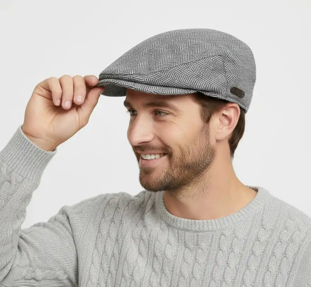 Classic flat cap with traditional herringbone tweed