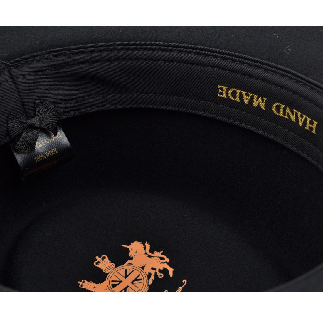 The Crushable Wool Felt Gambler Cowboy Hat with Black Band is a stylish and practical accessory, crafted from water-repellent, packable 100% wool felt. The Gambler shape features a round telescopic crown and a curved brim, making it a classic and distinctive choice. Finished with a comfortable cotton sweatband, this hat has a 10cm high crown and an 8.5cm wide brim, combining tradition with modern comfort.