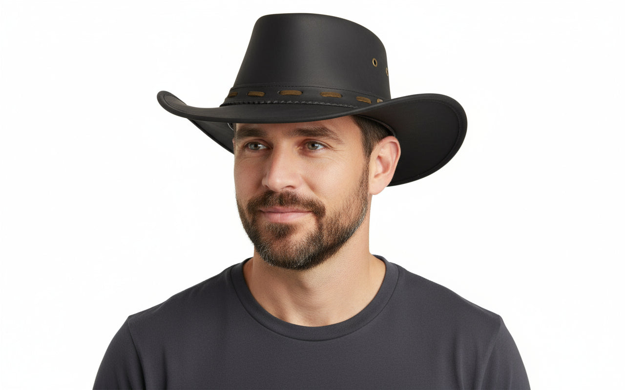Authentic leather cowboy hat in classic Black or Dark Brown. Features traditional pinched crown, wide protective brim, and premium leather construction that ages beautifully. Available in sizes 55-60cm. Perfect for ranch work, festivals, and outdoor adventures. Genuine leather that gets better with age.