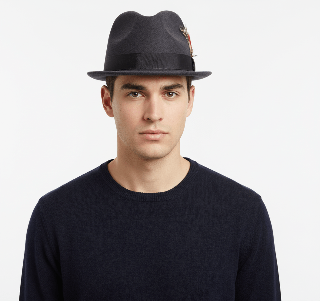 White short-brim Trilby handmade from pure wool felt (sizes 55-60cm). Each hat showcases a grosgrain ribbon, feather detail, and superior craftsmanship. Choose from Black, White, Grey, or Brown. The traditional shape and shorter brim make it versatile for both formal and casual wear.