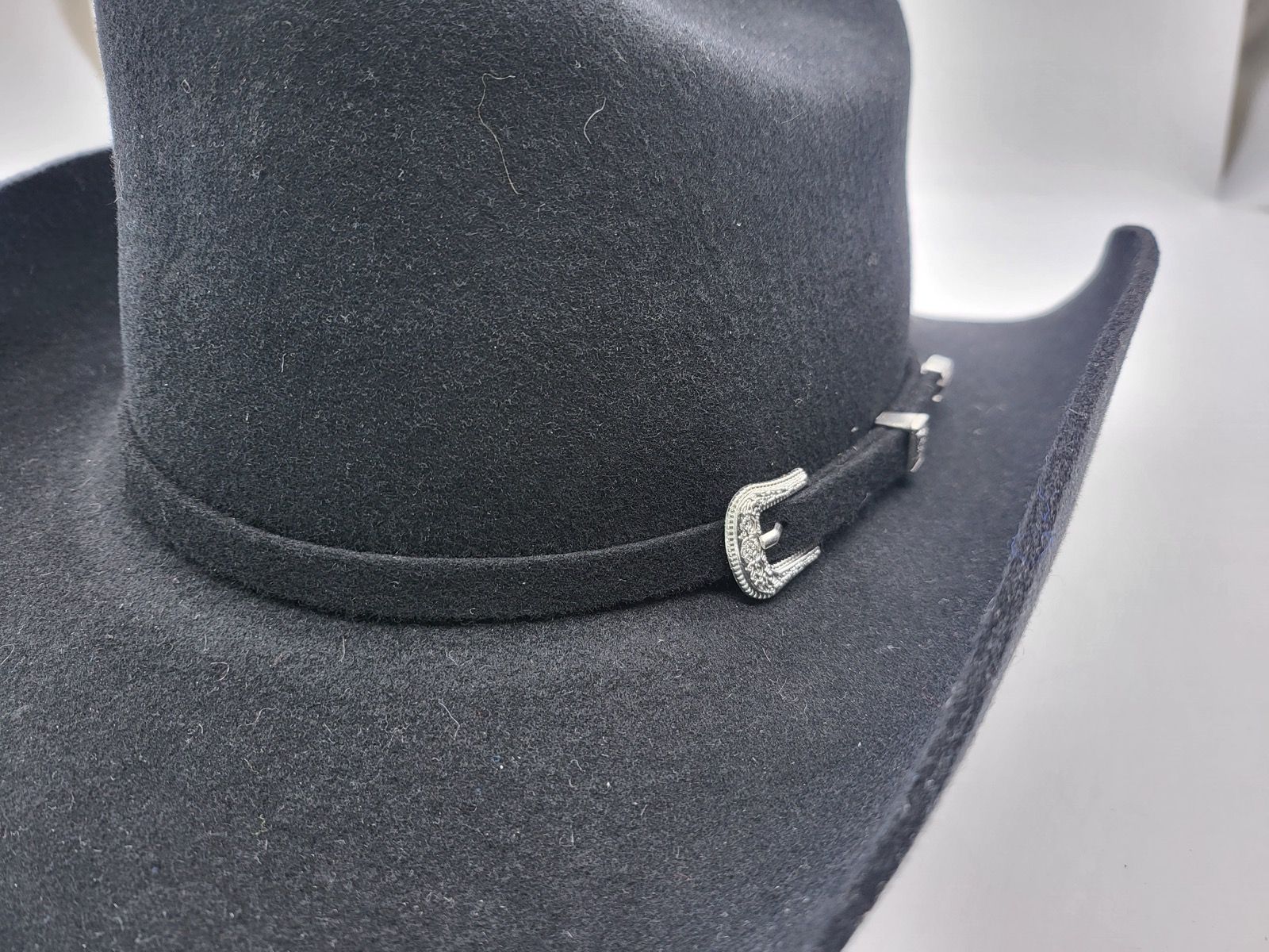 Authentic handmade wool felt cowboy hat crafted for the true Western enthusiast. Built with 100% pure wool for superior shape retention and durability. Available in Black and Brown, sizes 55-60cm. Each hat combines traditional rancher style with premium comfort for lasting quality.