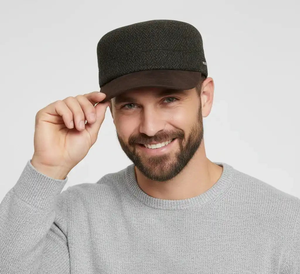 The Novella Hats Herringbone Army Cap is a modern take on the classic military-style cap, crafted for everyday wear. Made from a premium wool-blend fabric, it offers a clean silhouette with a timeless herringbone pattern in green or grey.