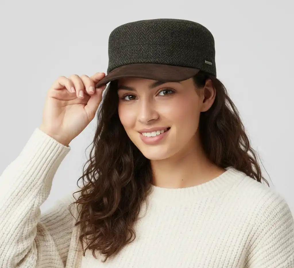 The Novella Hats Herringbone Army Cap is a modern take on the classic military-style cap, crafted for everyday wear. Made from a premium wool-blend fabric, it offers a clean silhouette with a timeless herringbone pattern in green or grey.