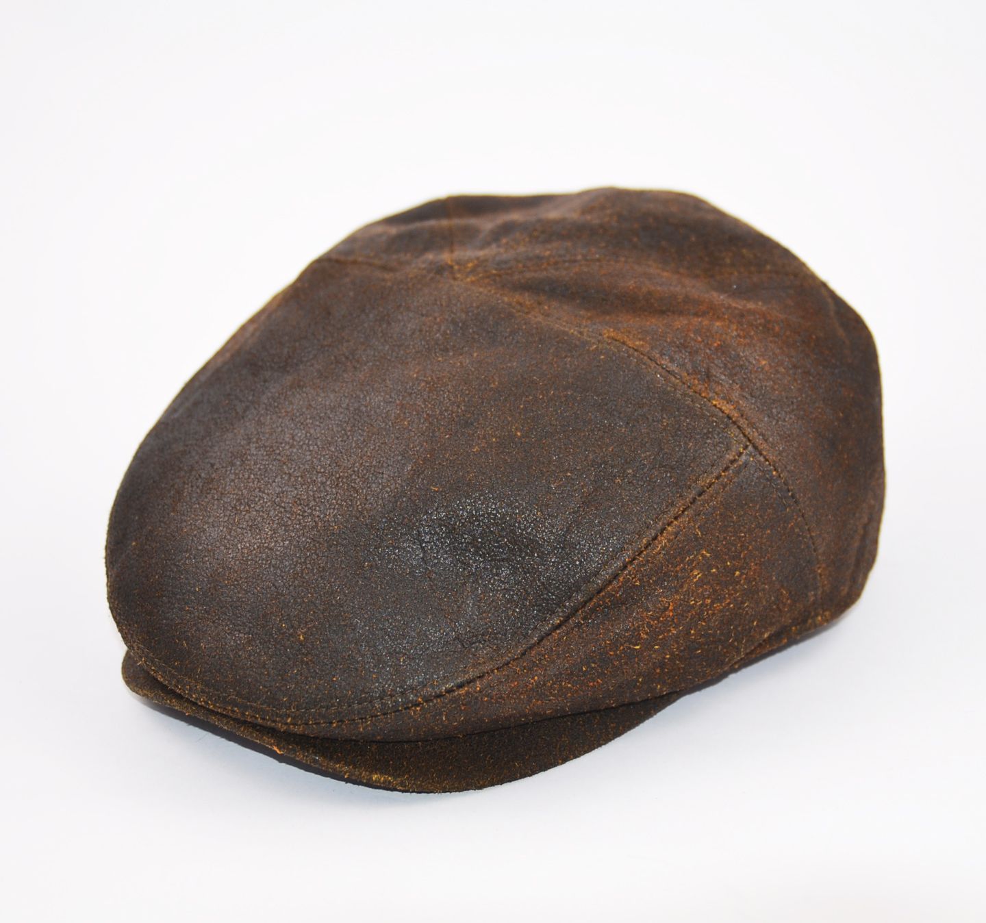 Discover the London Leather Flat Cap in Brown, crafted from 100% sheepskin leather for a vintage look. Features include a five-panel design, cotton lining, and a 4.8 cm visor. Available in sizes S/M/L/XL. Enjoy timeless style and comfort. Hat Details: Material: 100% Sheepskin Leather Lining: 100% Cotton Visor