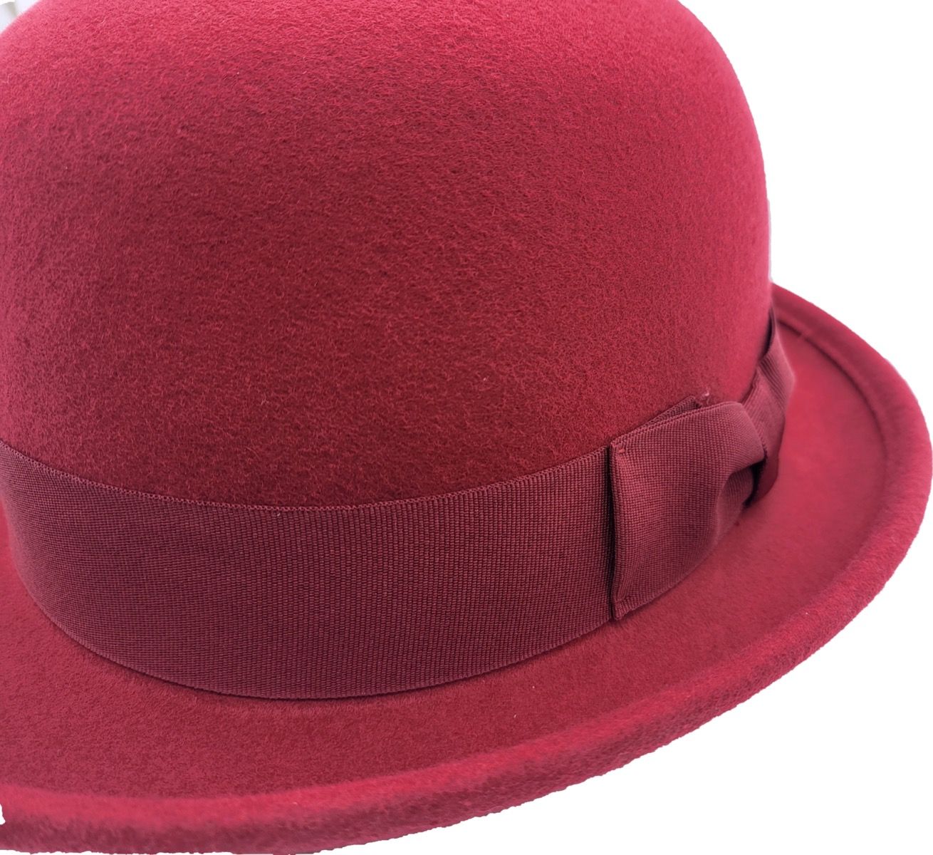 handcrafted soft bowler hat made from 100% premium wool felt. Features a classic grosgrain band and flexible structure for all-day comfort. Available in Black, Burgundy, Royal Blue, and Teal, sizes 55-60cm. Each hat is handmade with care, offering the perfect blend of traditional style and soft wearability