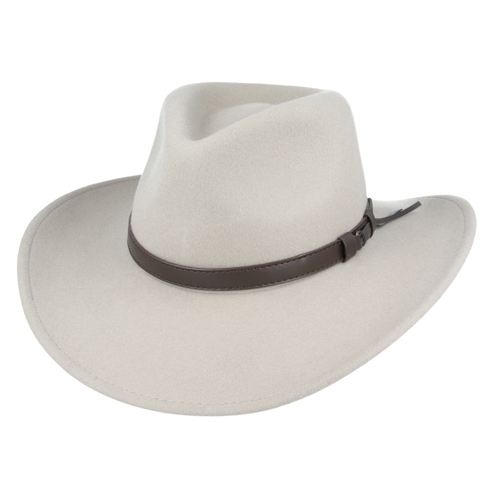 The Crushable Wool Felt Cowboy Hat from the Novella Hats Wool collection combines fashion and function. This handmade hat features a wide brim and high crown, offering both style and practicality. It's packable—just take it out of a suitcase, shake and shape it, and it's ready to wear.