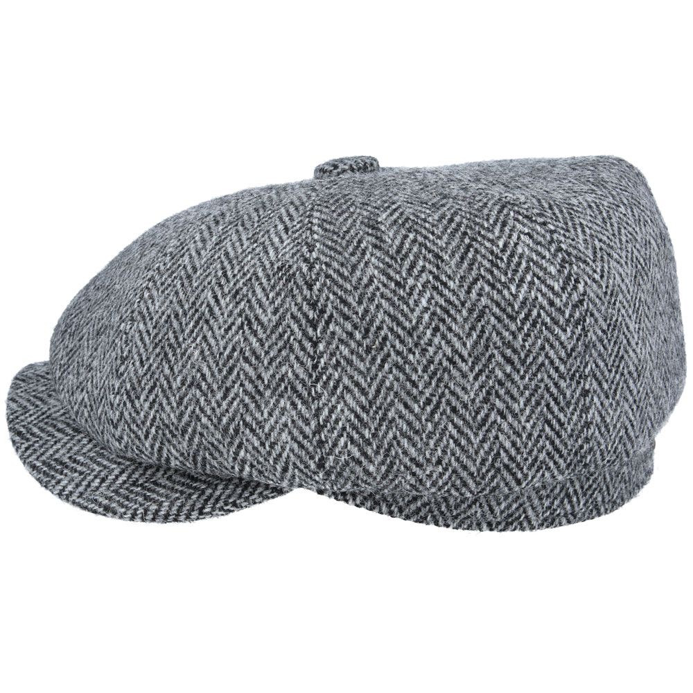 Grey Harris Tweed Herringbone Newsboy Cap, crafted from 100% pure new wool, handwoven in Scotland’s Outer Hebrides. Features include a sewn-down brim, cotton lining, and a removable Gladwin Bond side pin. Available in sizes S-XL. Inspired by the iconic Peaky Blinders style.