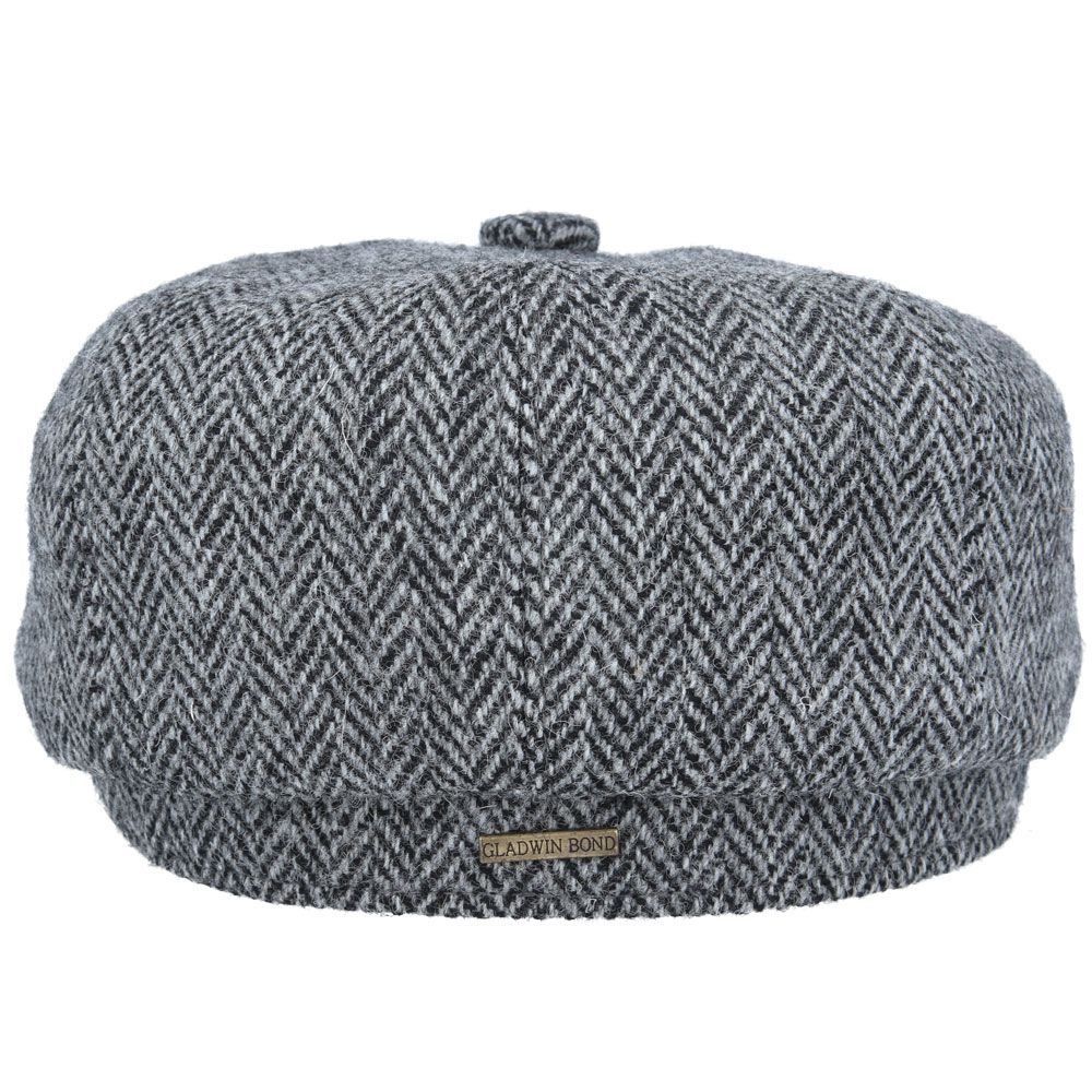 Grey Harris Tweed Herringbone Newsboy Cap, crafted from 100% pure new wool, handwoven in Scotland’s Outer Hebrides. Features include a sewn-down brim, cotton lining, and a removable Gladwin Bond side pin. Available in sizes S-XL. Inspired by the iconic Peaky Blinders style.