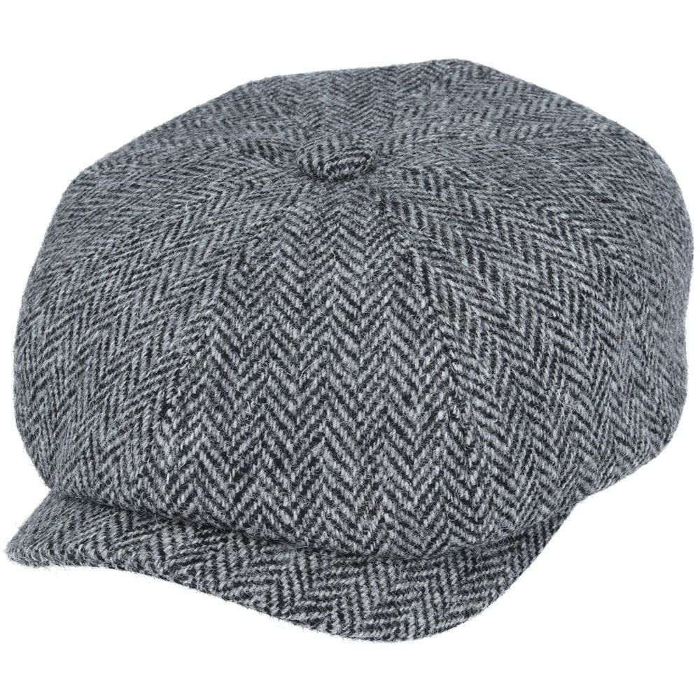 Grey Harris Tweed Herringbone Newsboy Cap, crafted from 100% pure new wool, handwoven in Scotland’s Outer Hebrides. Features include a sewn-down brim, cotton lining, and a removable Gladwin Bond side pin. Available in sizes S-XL. Inspired by the iconic Peaky Blinders style.