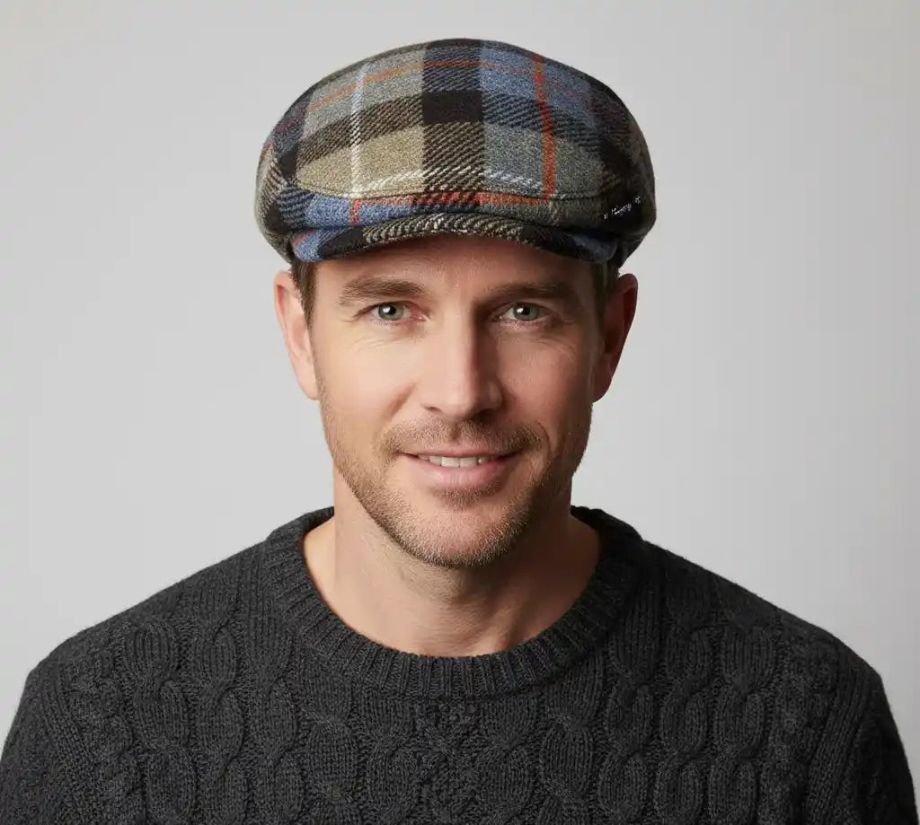 Side view of wool tartan flat cap showing checked pattern
